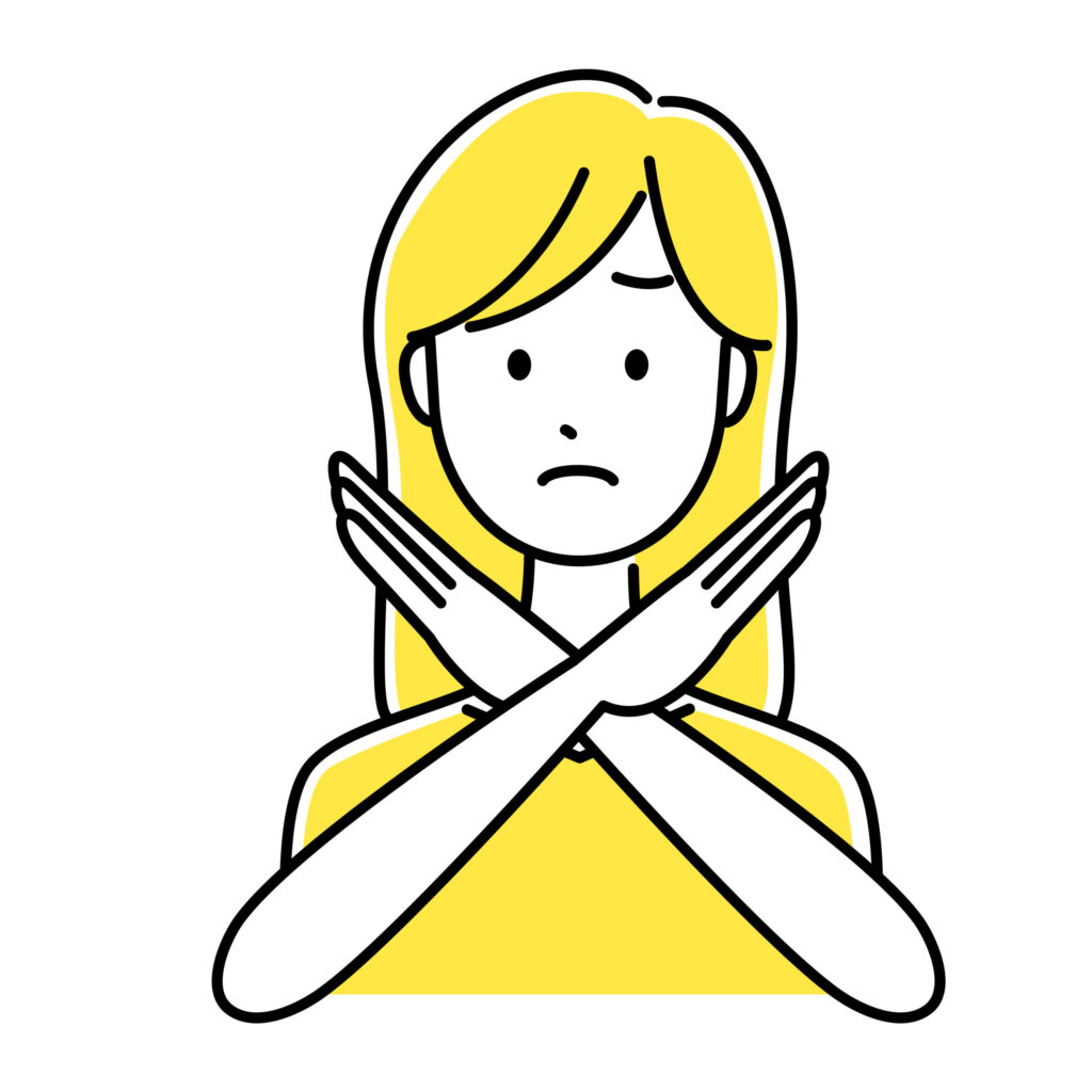 女性がバツサインをしている